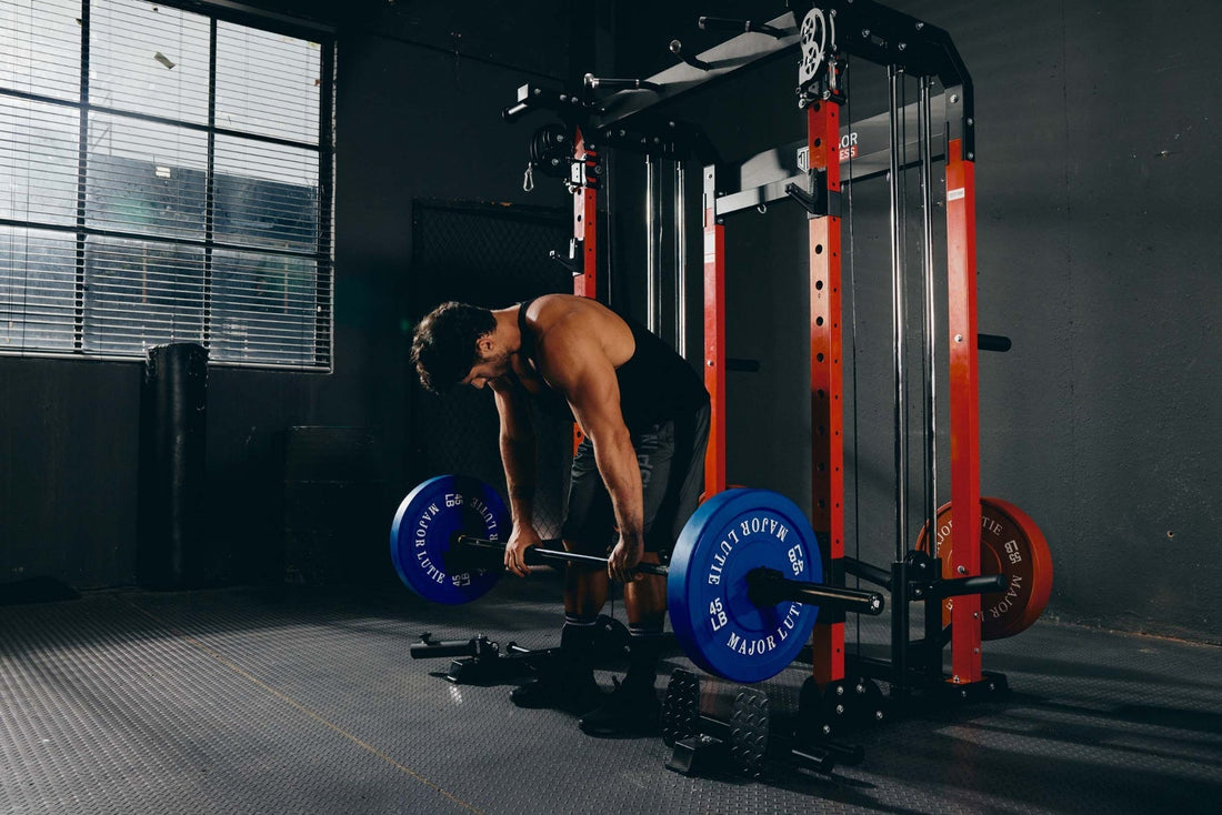 Man doing a deadlift workout using a Smith machine.