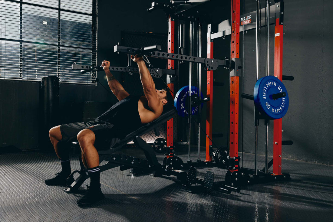 Man engaging in an incline bench press exercise on a power rack in a home gym setup.