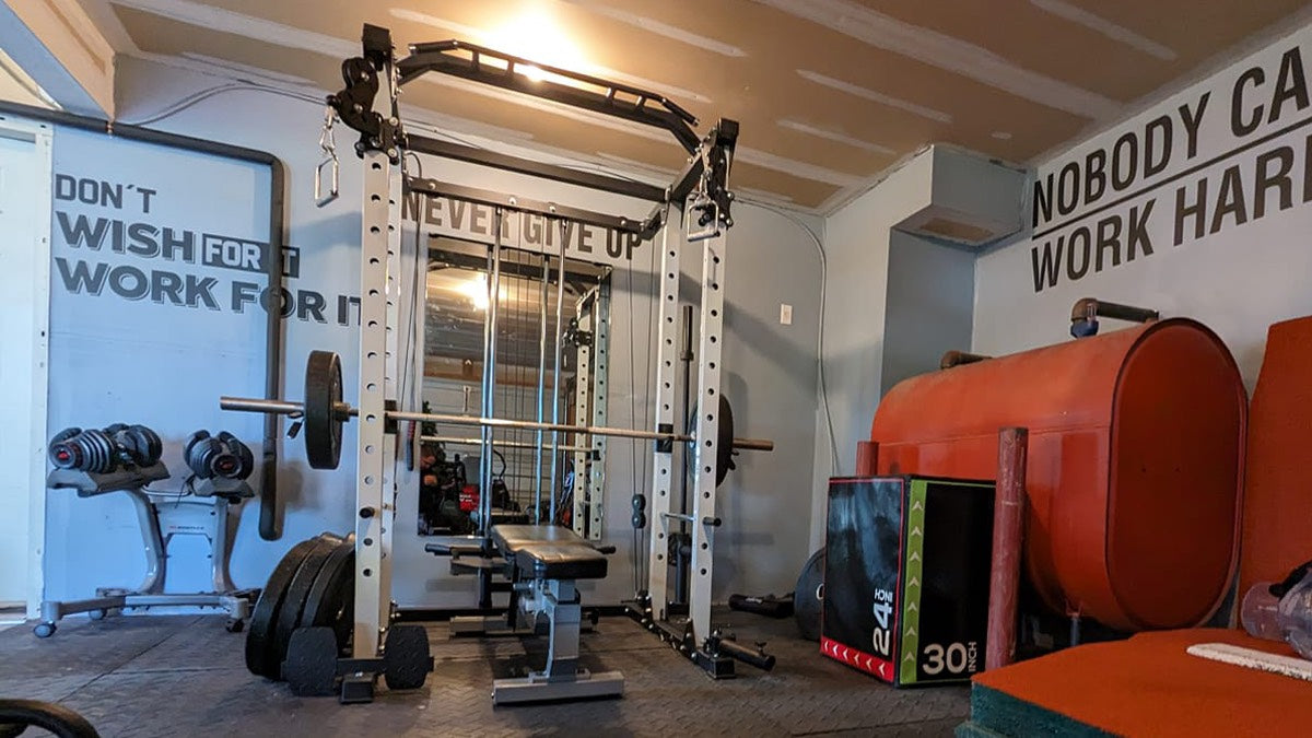 basement gym set up with white major fitness power rack PLM03