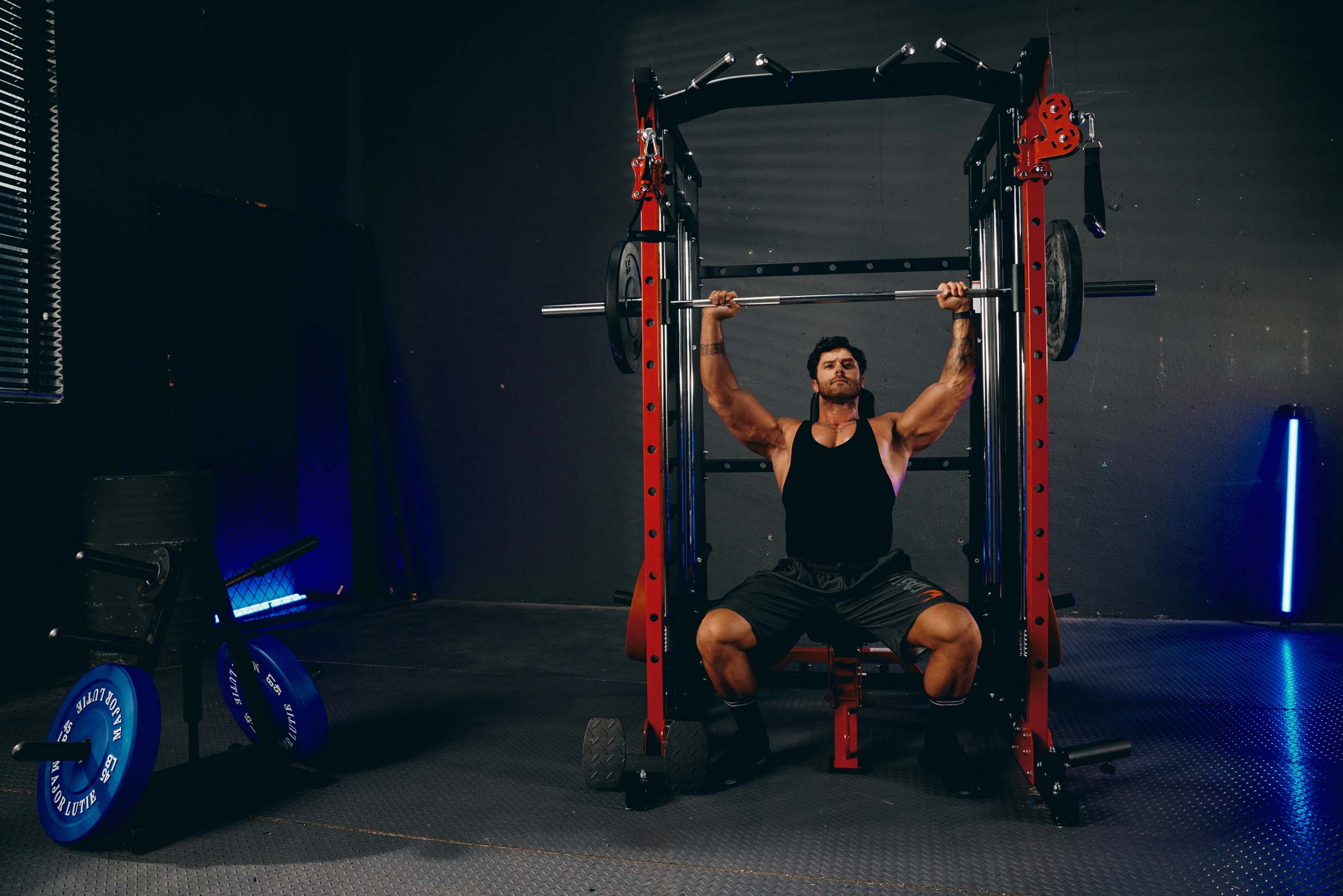 a man doing bench press on a smith machine called sml07