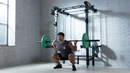 Strength training in a home gym with a Smith machine and barbell squat.