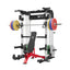 home gym workout equipment raptor f22 white with a red bench, a silver barbell, a 230lb bumper weight plates set and a pair of 55lb urethane plates
